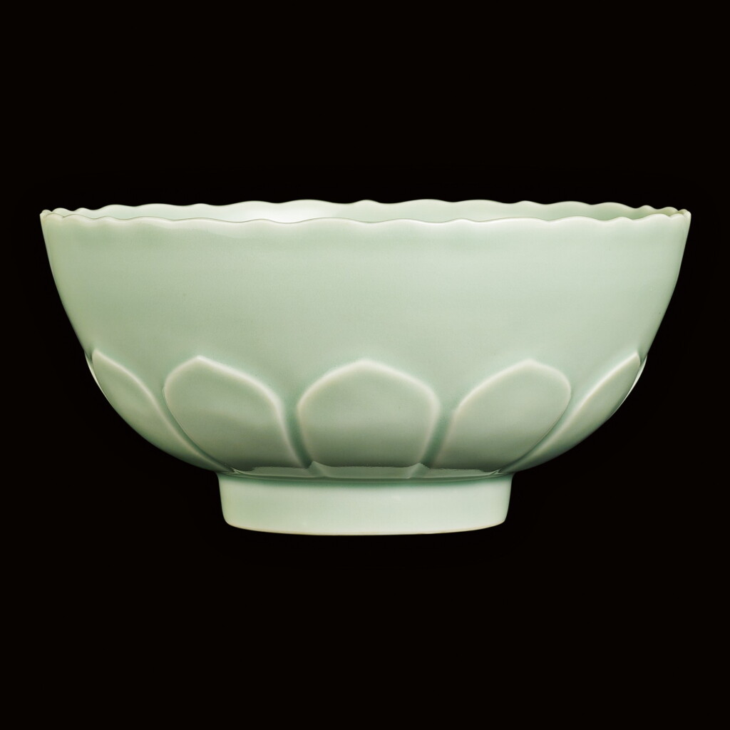 View full screen - View 1 of Lot 4. A FINE AND RARE CELADON-GLAZED BOWL SEAL MARK AND PERIOD OF QIANLONG | 清乾隆 粉青釉浮雕蓮瓣花口盌 《大清乾隆年製》款.