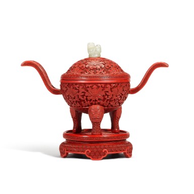 View full screen - View 1 of Lot 430. A carved cinnabar lacquer tripod censer, cover and a stand, Qing dynasty, Qianlong period | 清乾隆 剔紅纏枝蓮獅鈕三足蓋爐連座.