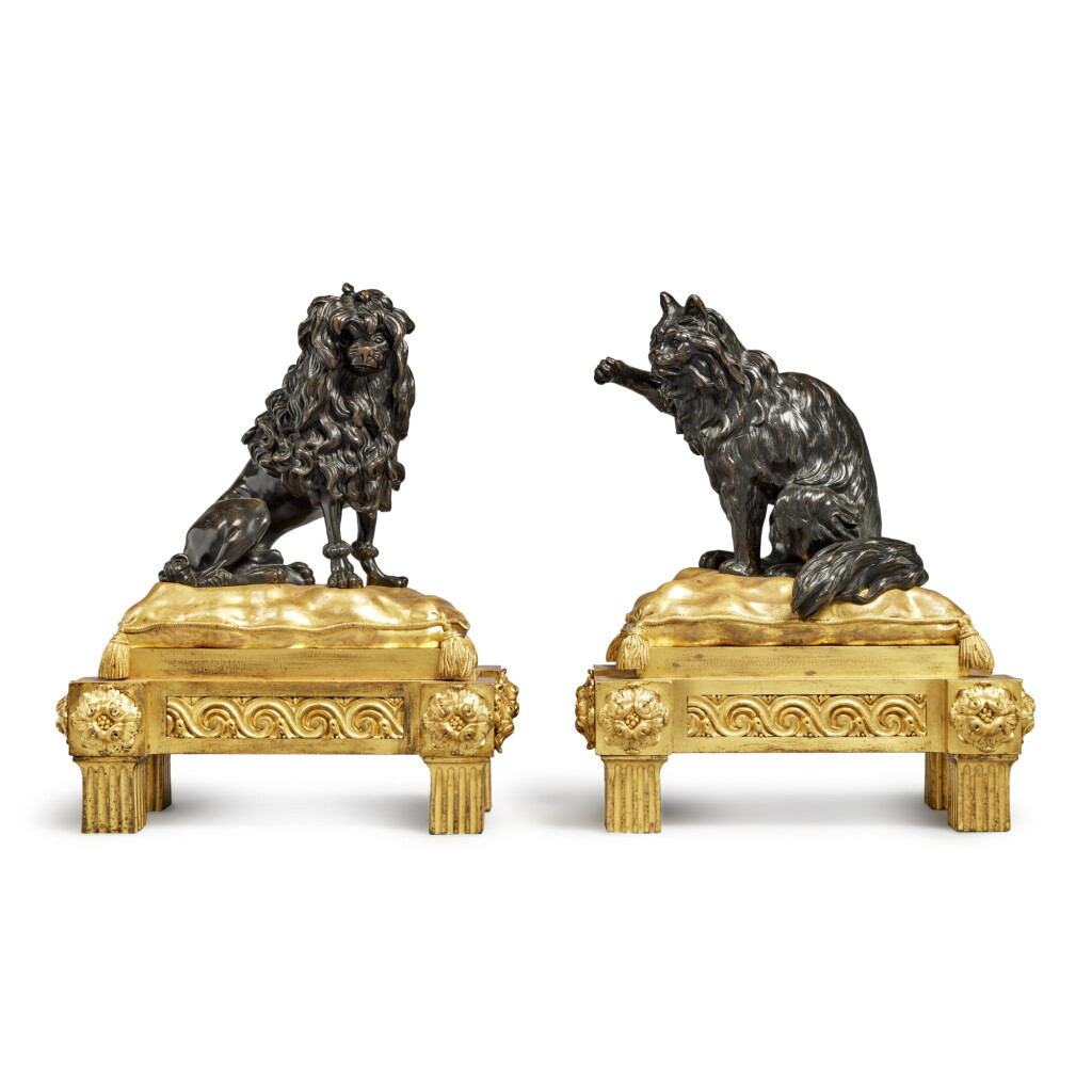 View full screen - View 1 of Lot 1086. A Pair of Louis XVI Style Gilt and Patinated Bronze Figural Chenets.