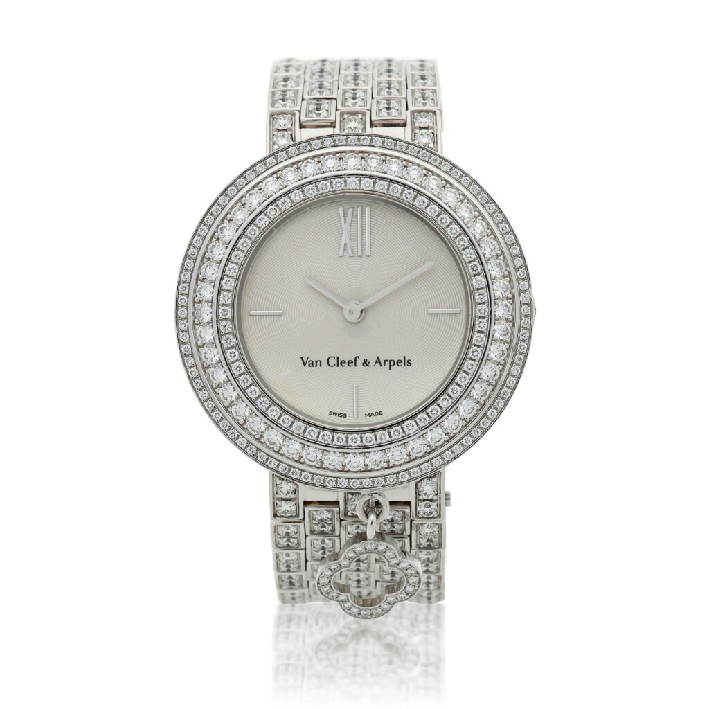 View full screen - View 1 of Lot 159. Mini Charms, A white gold and diamond-set bracelet watch, Circa 2013.