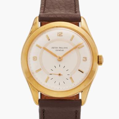 View full screen - View 1 of Lot 133. Reference 2543 Calatrava | A rare yellow gold wristwatch with unusual two-tone dial, Made in 1954.