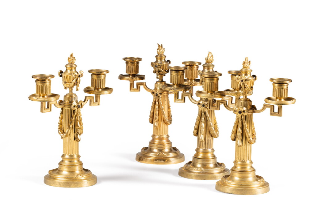 View full screen - View 1 of Lot 119. A set of four Louis XVI gilt-bronze candelabra | Suite de quatre candélabres en bronze doré d'époque Louis XVI.