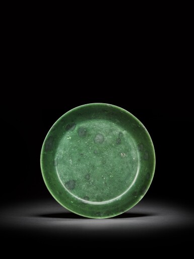 View full screen - View 1 of Lot 19. A spinach-green jade dish, Mark and period of Qianlong | 清乾隆 碧玉盤《大清乾隆年製》款.