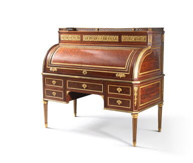 View full screen - View 1 of Lot 318. A Louis XVI gilt-bronze mounted and plum-pudding mahogany cylinder desk, stamped by Joseph Stockel and Guillaume Benneman | Bureau à cylindre en acajou moucheté, montures de bronze doré, d'époque Louis XVI, estampille de Joseph Stockel et Guillaume Benneman.