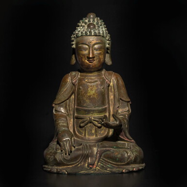 View full screen - View 1 of Lot 817. A parcel-gilt bronze seated figure of Buddha, Ming dynasty | 明 銅鎏金佛坐像.
