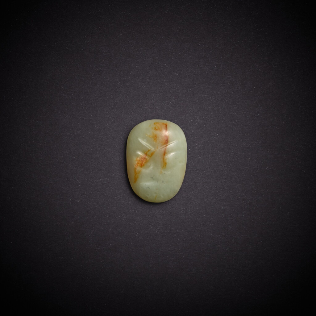 View full screen - View 1 of Lot 7805. A yellowish-celadon jade 'mask' ornament, Neolithic period, Hongshan culture | 新石器時代 紅山文化 青黃玉人面飾.