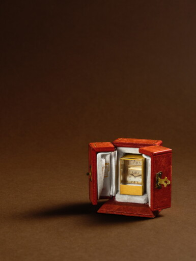 View full screen - View 1 of Lot 2259. A fine and unusual yellow gold miniature prism clock with fitted presentation box, Circa 1953 .
