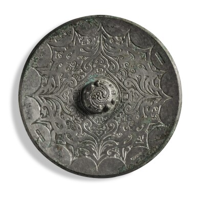 View full screen - View 1 of Lot 108. An inscribed bronze 'phoenix' mirror, Eastern Han dynasty | 東漢 銅鳳紋鏡.