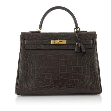 View full screen - View 1 of Lot 53. HERMÈS | CHOCOLATE BROWN KELLY 35 IN MATTE MISSISSIPPIENSIS ALLIGATOR LEATHER WITH GOLD HARDWARE, 2010.
