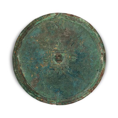 View full screen - View 1 of Lot 878. A small bronze mirror, Eastern Zhou dynasty, Warring States period | 東周 戰國 銅幾何花葉紋鏡.