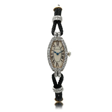 View full screen - View 1 of Lot 103. CARTIER | A PLATINUM AND DIAMOND SET WRISTWATCH, CIRCA 1920.