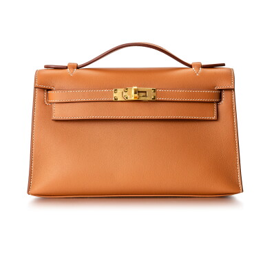 View full screen - View 1 of Lot 8510. Gold Kelly Pochette in Swift Leather with Gold Hardware, 2021.