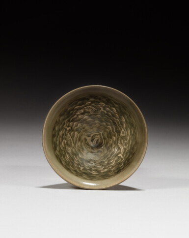 View full screen - View 1 of Lot 49. A 'Yaozhou' celadon-glazed 'marine life' bowl, Song dynasty | 宋 耀州青窰水波游魚紋盌.