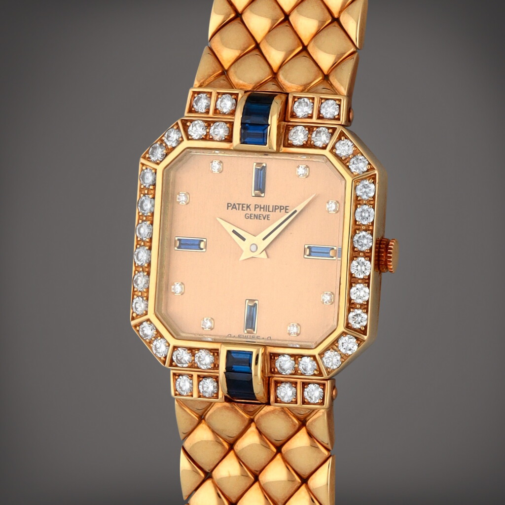 View full screen - View 1 of Lot 254. Reference 4810/2 | A yellow gold sapphire and diamond-set wristwatch with bracelet | Circa 1989.