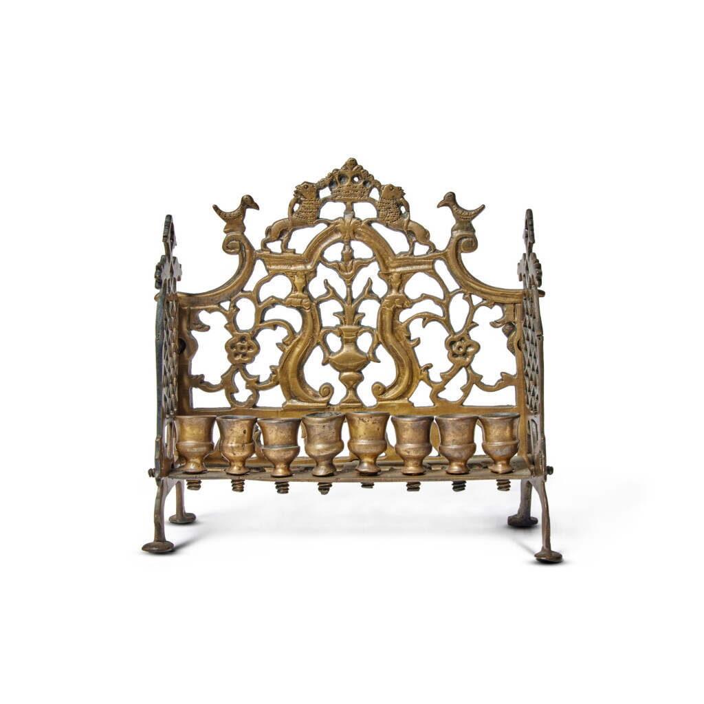 View full screen - View 1 of Lot 213. A Galician Brass Hanukkah Lamp, 19th century.