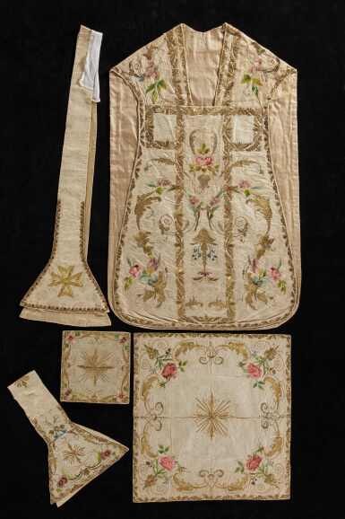View full screen - View 1 of Lot 249. An ivory silk figured lampas, embroidered and metal-thread floral chasuble, Italian, with matching accessories, second quarter 18th century.