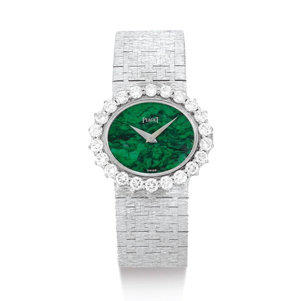 View full screen - View 1 of Lot 2141. PIAGET | REFERENCE 9330 A6 A WHITE GOLD AND DIAMOND-SET BRACELET WATCH WITH MALACHITE HARDSTONE DIAL, CIRCA 1975" | 伯爵 | 型號9330 A6 白金鑲鑽石鏈帶腕錶,備孔雀石錶盤,錶殼編號135251,約1975年製".