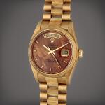 Reference 18078 Day-Date ‘Birch’ | A yellow gold automatic wristwatch with day, date, wood dial, and bark bezel and bracelet, Circa 1979
