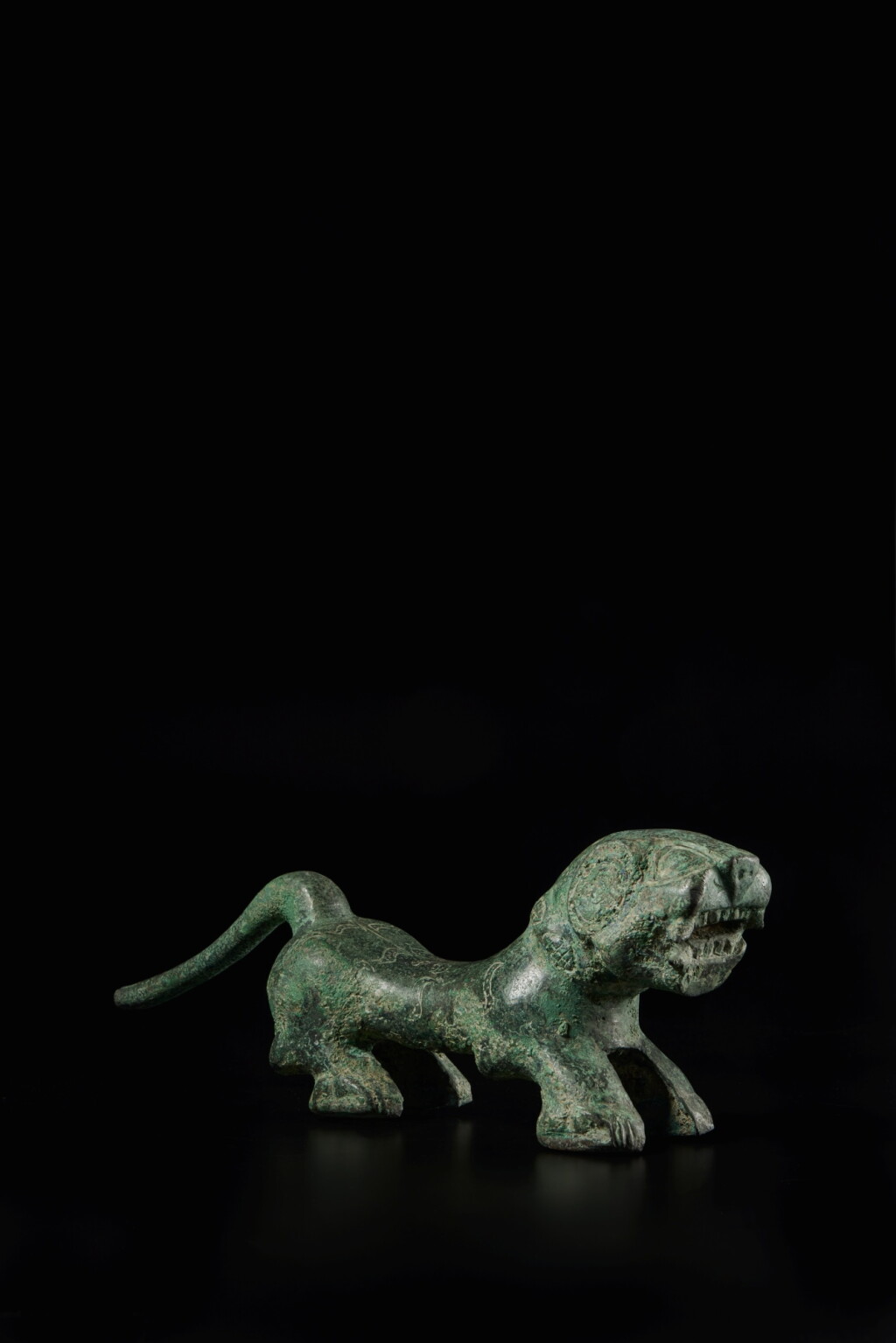 View full screen - View 1 of Lot 253. A rare large bronze figure of a tiger, Eastern Zhou dynasty, Warring States period | 東周 戰國 青銅虎鈕.