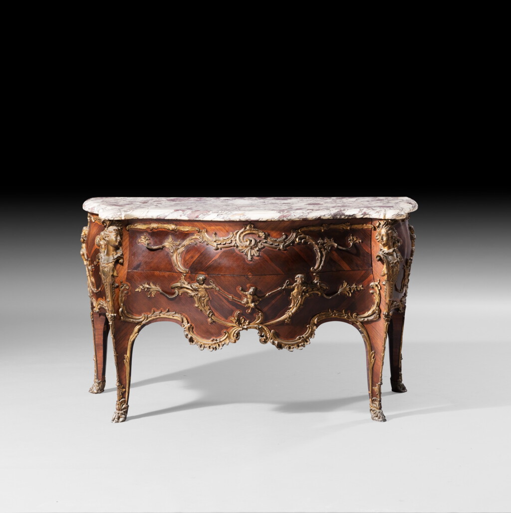 View full screen - View 1 of Lot 43. A Louis XV style giltbronze mounted tulipwood and palissander commode, late 19th century, attributed to François Linke, after a model by Charles Cressent | Commode en placage de bois de rose, palissandre et monture de bronze doré de style Louis XV, fin du XIXème siècle, attribuée à François Linke, d'après un modèle de Chales Cressent.