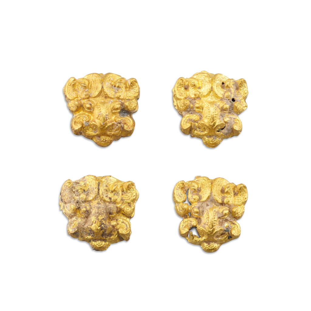 View full screen - View 1 of Lot 3025. A set of four gold-alloy animal-mask form fittings, Eastern Zhou dynasty 東周 金合金獸面紋飾一組四件.