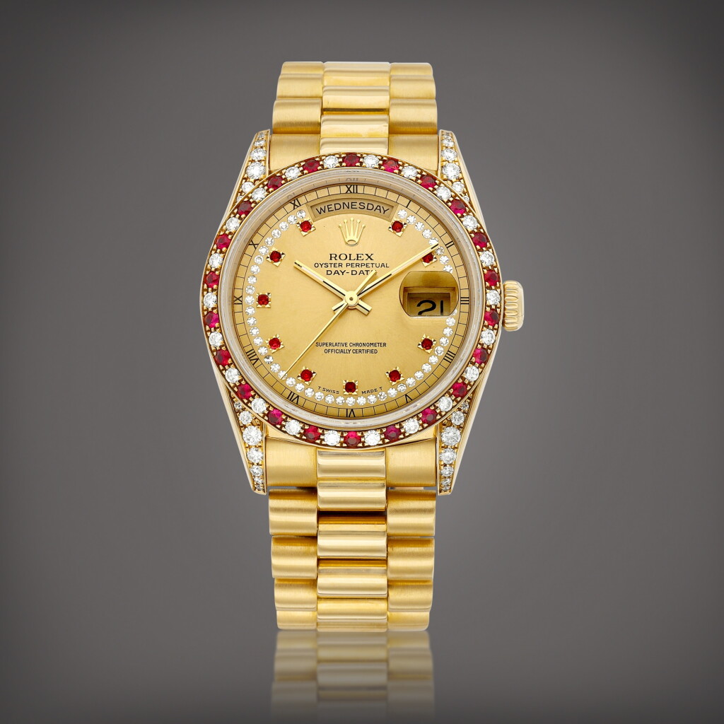 View full screen - View 1 of Lot 727. Day-Date, Reference 18388 | A yellow gold, diamond and ruby-set wristwatch with day, date and bracelet, Circa 1990 | 勞力士 | Day-Date 型號18388 | 黃金鑲鑽石及紅寶石鏈帶腕錶,備日期及星期顯示,約1990年製.
