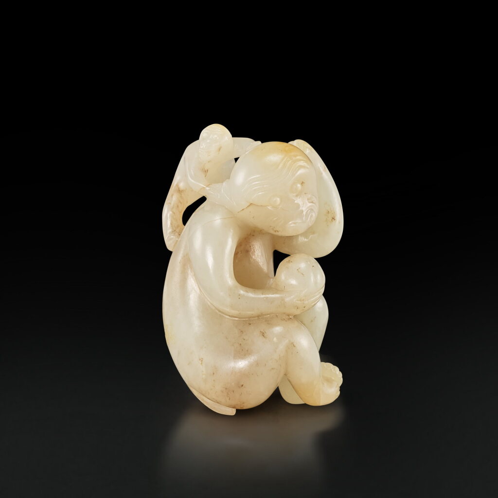 View full screen - View 1 of Lot 3672. A white and russet jade figure of a monkey, Ming dynasty | 明 白玉靈猴獻壽.