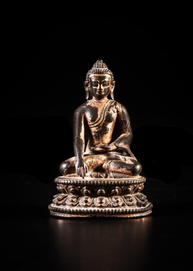 View full screen - View 1 of Lot 6. A gilt-copper figure of Shakyamuni Buddha, Tibet, 14th / 15th century | 十四 / 十五世紀 藏傳鎏金銅釋迦牟尼佛坐像.