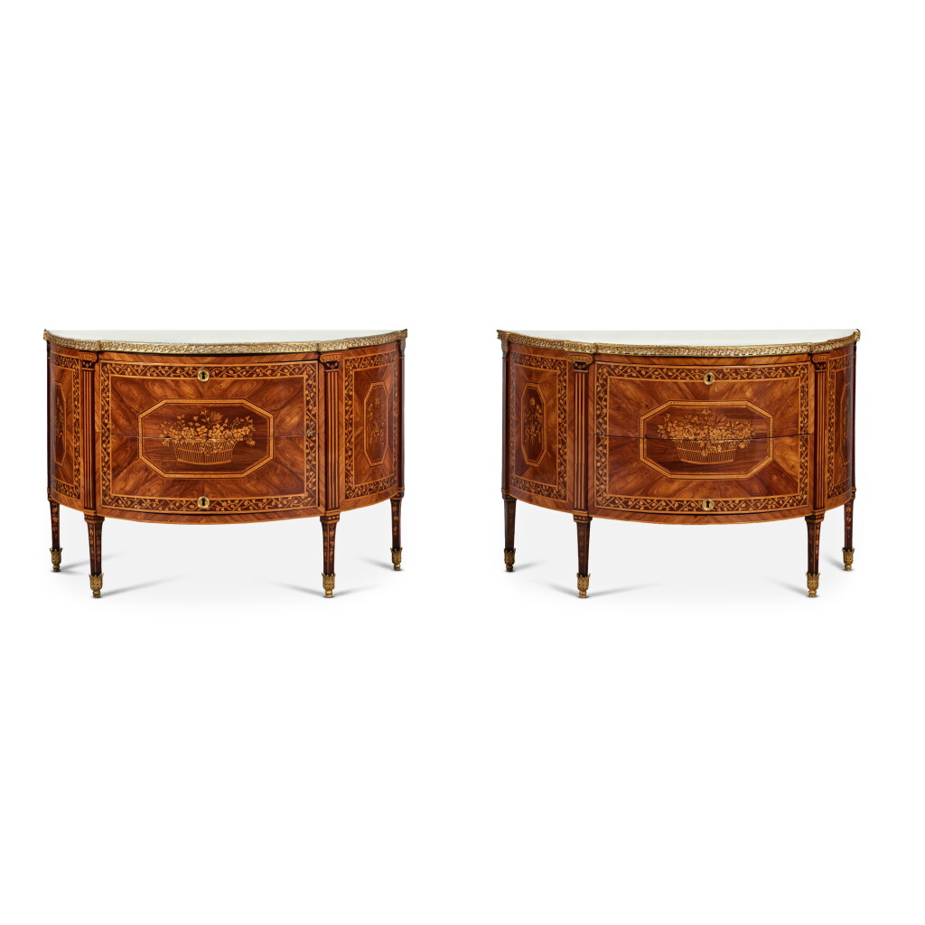 View full screen - View 1 of Lot 659. A Pair of Italian Neoclassical Gilt Metal Mounted Kingwood, Walnut, Sycamore and Fruitwood Marquetry Demilune Commodes, late 18th Century.