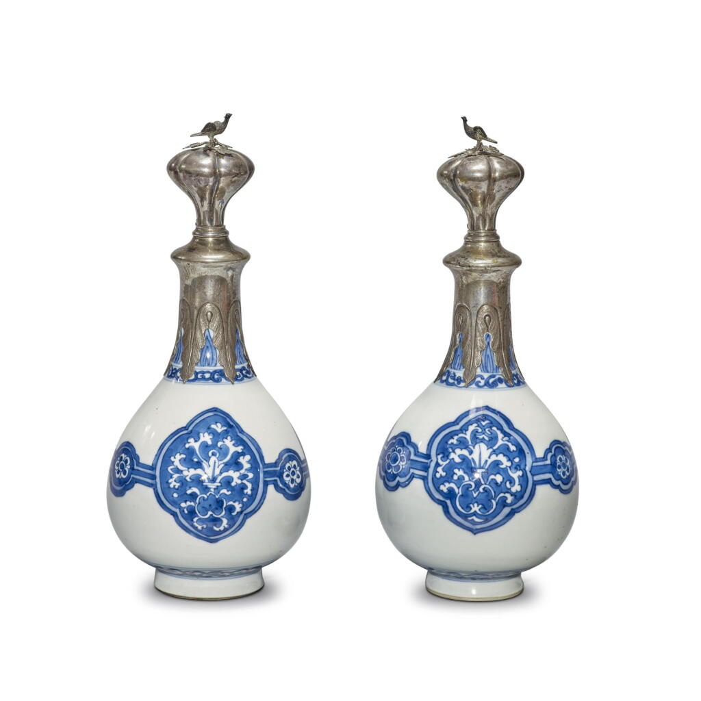 View full screen - View 1 of Lot 942. A pair of silver-mounted blue and white bottle vases, Qing dynasty, Kangxi period | 清康熙 青花花卉紋瓶一對配後鑲銀口.
