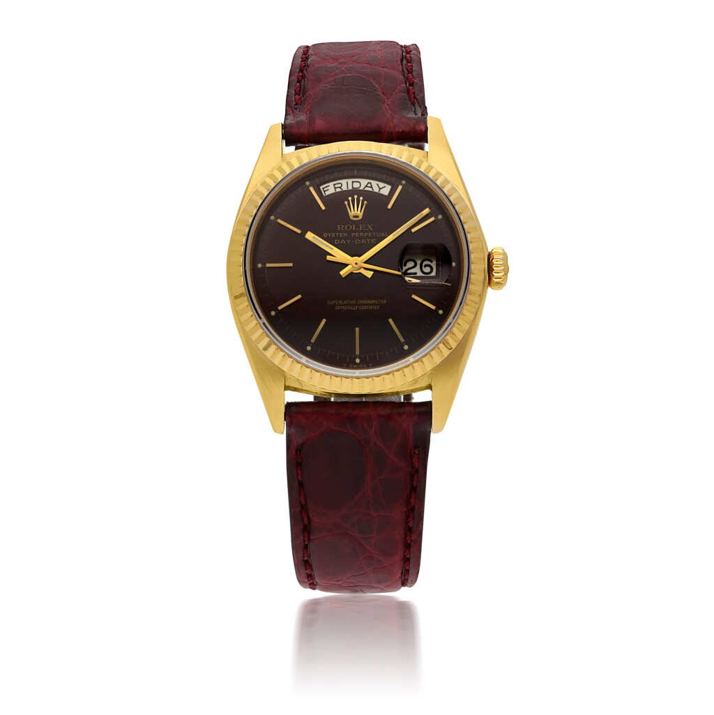 View full screen - View 1 of Lot 132. ROLEX | 'STELLA' DAY-DATE, REF 1803 YELLOW GOLD WRISTWATCH WITH OX BLOOD DIAL CIRCA 1978.
