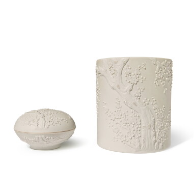 View full screen - View 1 of Lot 33. A carved white biscuit 'prunus' brushpot and seal paste box and cover, Qing dynasty, 19th century.