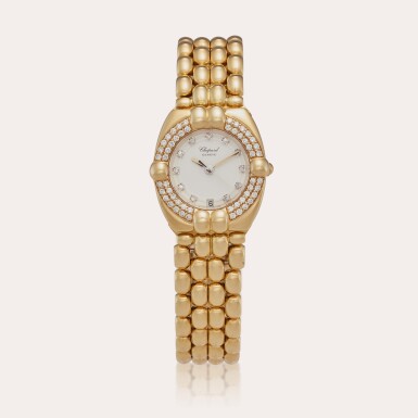 View full screen - View 1 of Lot 348. Reference 325219-0001 Gstaad | A yellow gold and diamond-set bracelet watch with date, Circa 1990.