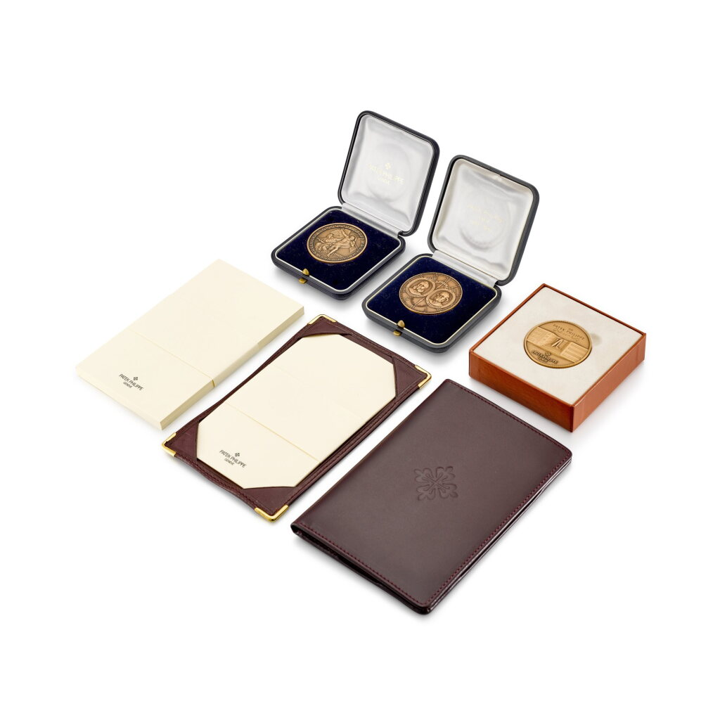 View full screen - View 1 of Lot 8810. A set of three bronze commemorative medals with two notepads, Circa 2000 | 百達翡麗 | 一套三件紀念銅幣及兩本筆記本,約2000年製.