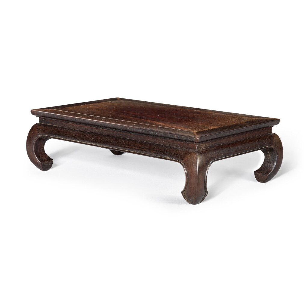 View full screen - View 1 of Lot 121. A rectangular 'zitan' stand, Qing dynasty, 18th century | 清十八世紀 紫檀有束腰鼓腿長方形座.