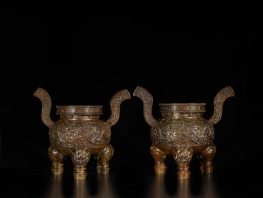 View full screen - View 1 of Lot 59. An exceptional and rare pair of bronze 'dragon' tripod censers, Marks and period of Qianlong | 清乾隆 銅雲龍戲珠紋朝冠耳三足爐一對 《大清乾隆年造》款.