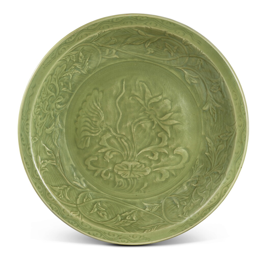 View full screen - View 1 of Lot 3689. A carved Longquan celadon 'lotus' charger Early Ming dynasty | 明初 龍泉青瓷浮雕蓮紋折沿盤.