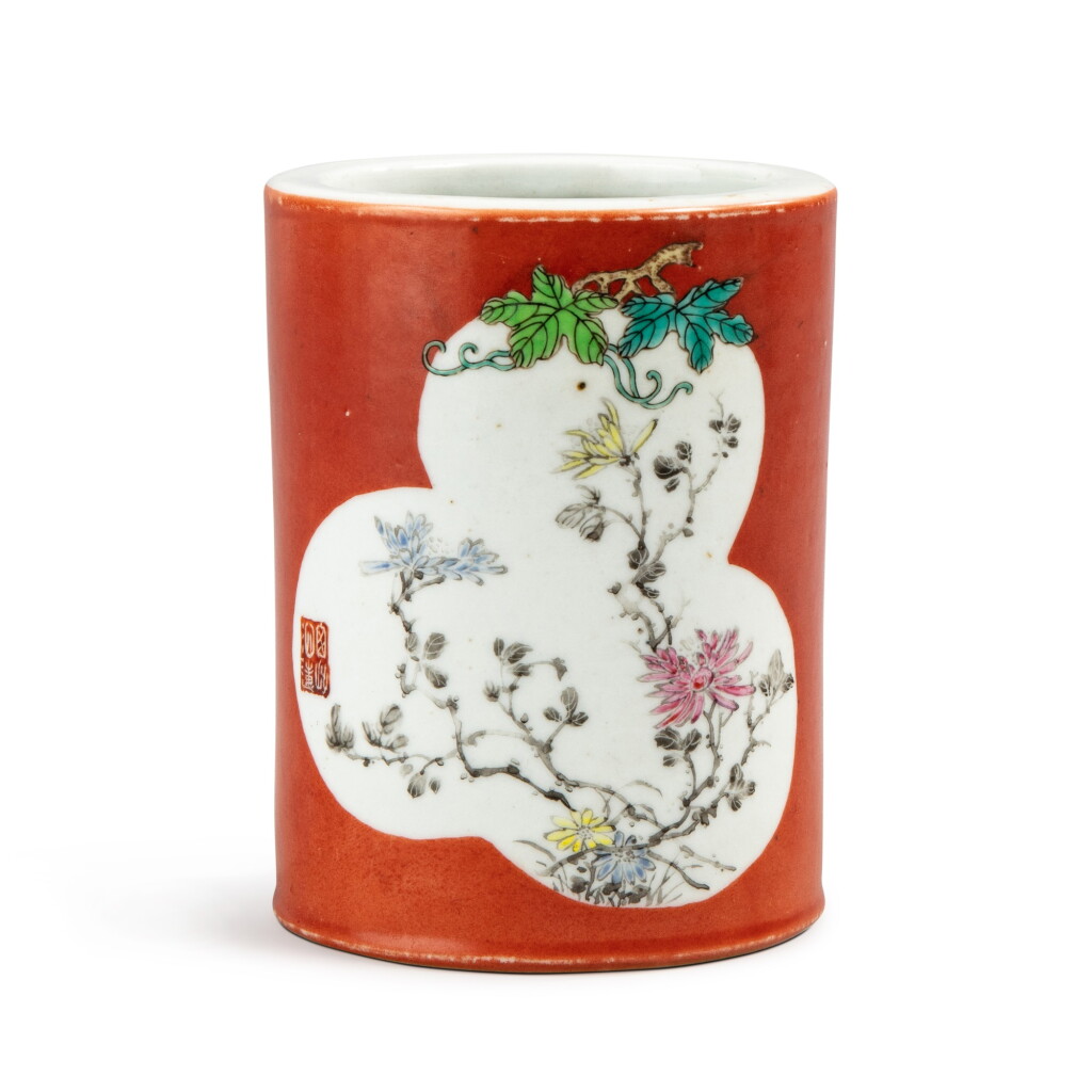 View full screen - View 1 of Lot 224. A coral-ground famille rose brushpot Qing dynasty, 18th century | 清十八世紀 珊瑚紅地開光粉彩菊花紋筆筒.