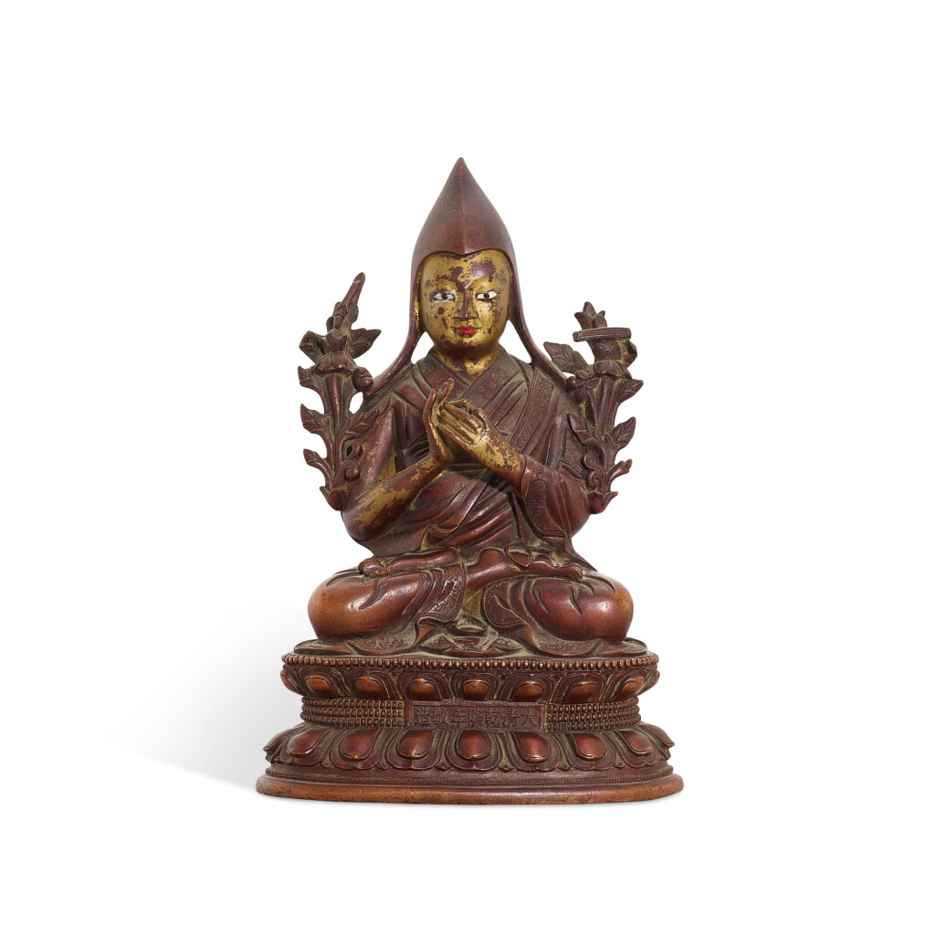 View full screen - View 1 of Lot 569. A gilt-lacquered bronze figure of a lama, mark and period of Qianlong 清乾隆 漆金銅喇嘛坐像 《大清乾隆年敬造》款.