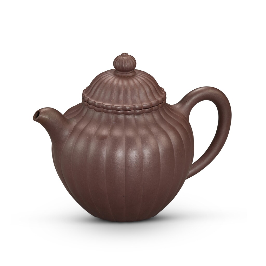 View full screen - View 1 of Lot 2043. A Yixing 'chrysanthemum' teapot and cover, Late Qing dynasty 清末 宜興紫砂菊瓣紋蓋壼.