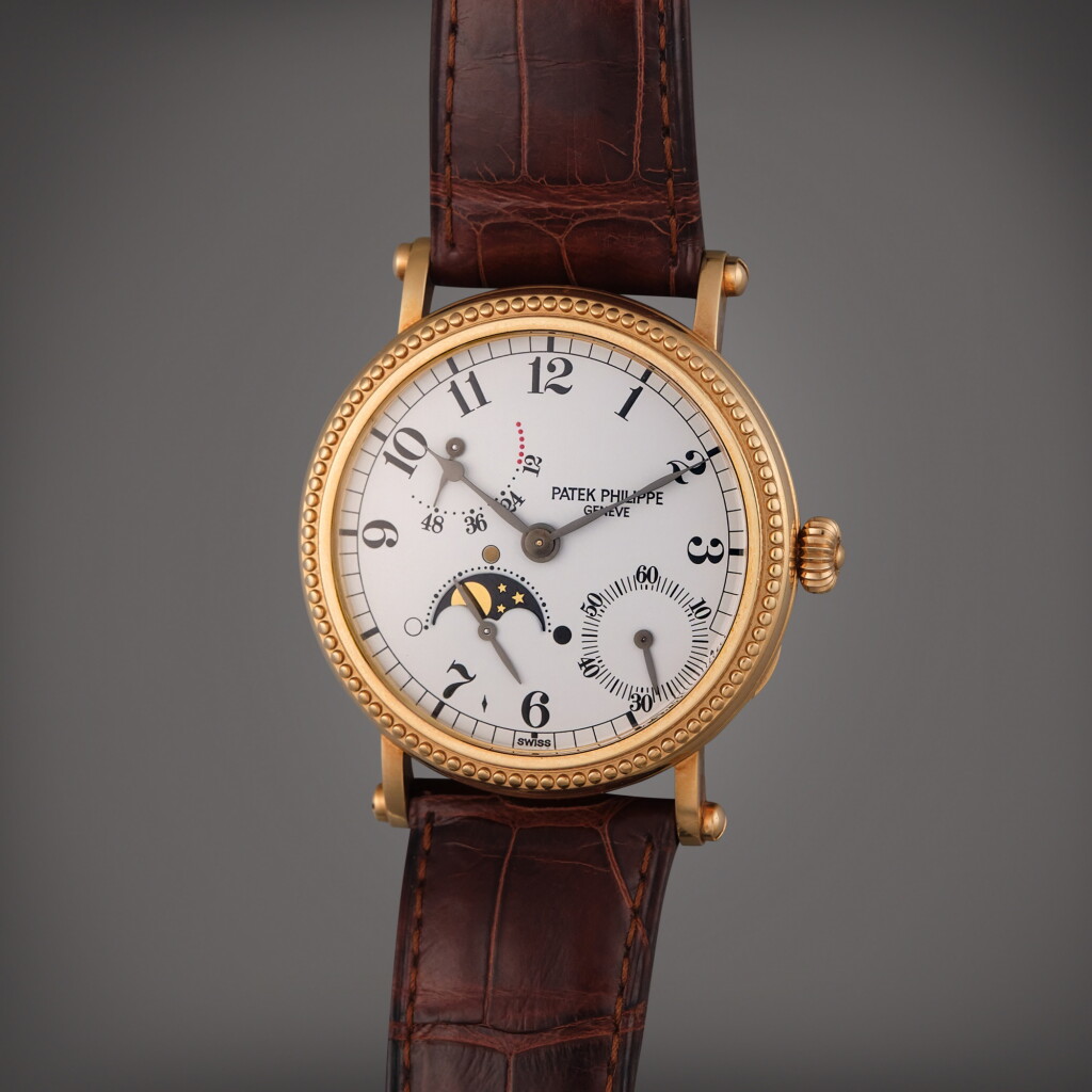 View full screen - View 1 of Lot 348. Reference 5015J | A yellow gold automatic wristwatch with moon phases and power reserve indication, Circa 1995.
