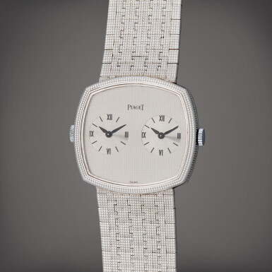 View full screen - View 1 of Lot 128. Reference 612401 A4 | A white gold dual time bracelet watch with two movements | Circa 1975 .