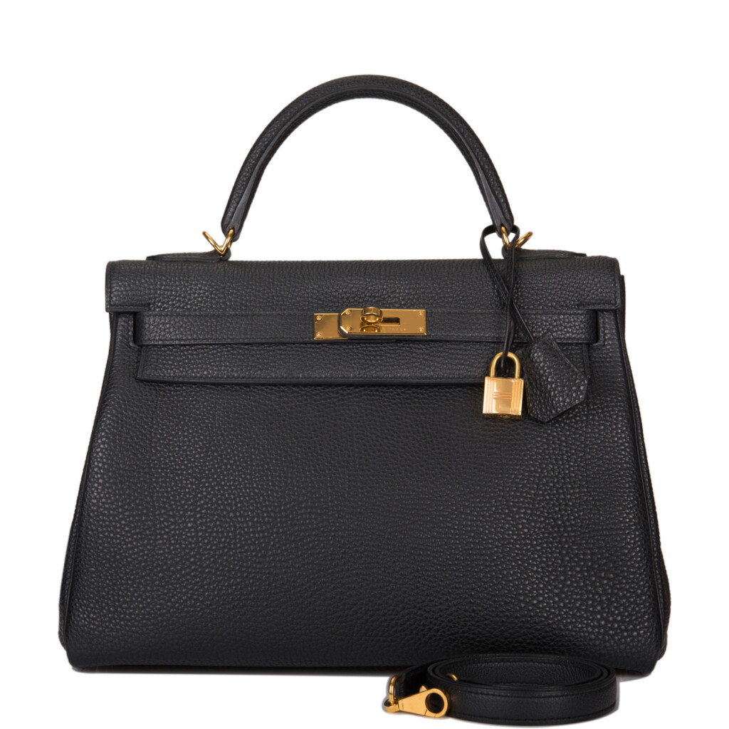 View full screen - View 1 of Lot 47. HERMÈS | BLACK RETOURNE KELLY 32CM OF CLEMENCE LEATHER WITH GOLD HARDWARE.