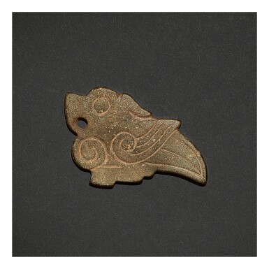 View full screen - View 1 of Lot 248. A CALCIFIED JADE 'BIRD' PENDANT, SHANG DYNASTY OR LATER.