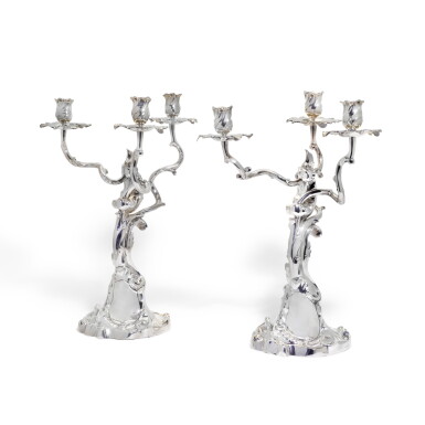 View full screen - View 1 of Lot 63. A PAIR OF CONTINENTAL THREE-LIGHT SILVER CANDELABRA, IN EXUBERANT ROCOCO STYLE AFTER JAN WILLEM BURGERS OF THE HAGUE, RETAILED BY BOIN-TABURET OF PARIS, CIRCA 1900.