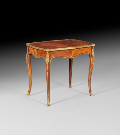 View full screen - View 1 of Lot 52. A Louis XV gilt-bronze mounted satinwood and amaranth writing table, stamped 'DELORME' | Table à écrire en placage de bois satiné, amarante et bronze doré d'époque Louis XV, estampillée "DELORME".