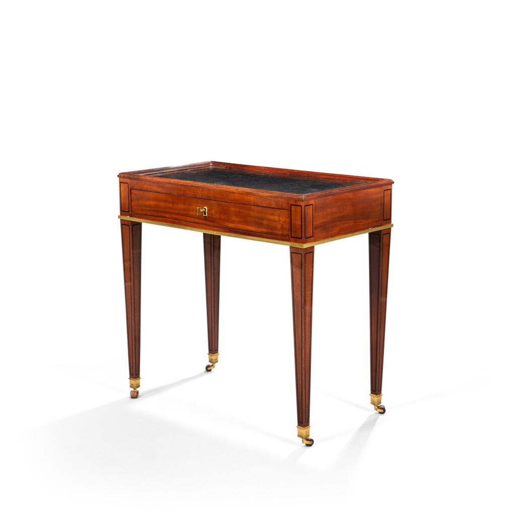 View full screen - View 1 of Lot 54. A Louis XVI gilt-bronze mounted mahogany and blackened wood veneered table en cabaret, circa 1785, stamped by Fidelys Schey.