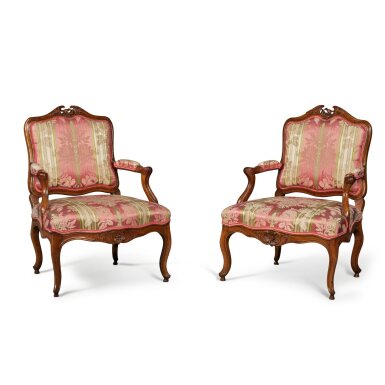 View full screen - View 1 of Lot 127. A Pair of Louis XV Carved Walnut Fauteuils a la Reine, Possibly Eastern France, Mid-18th Century.