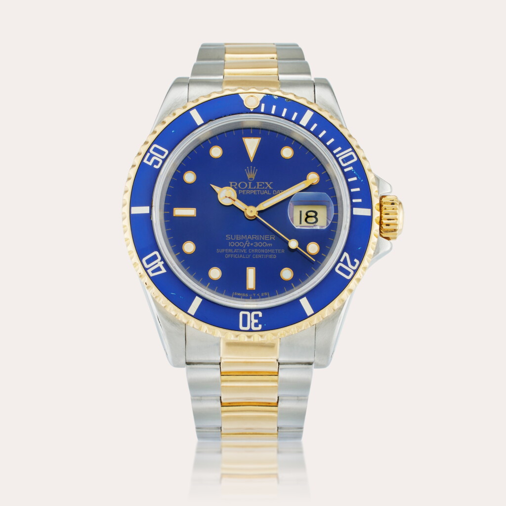 View full screen - View 1 of Lot 400. Reference 16613 Submariner | A yellow gold and stainless steel automatic wristwatch with date and bracelet, Circa 1990.