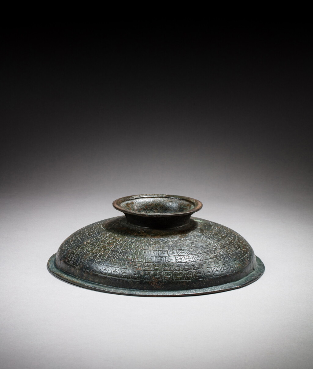 View full screen - View 1 of Lot 34. A cover of an archaic brass vessel, gui Eastern Zhou dynasty | 東周 銅簋蓋.
